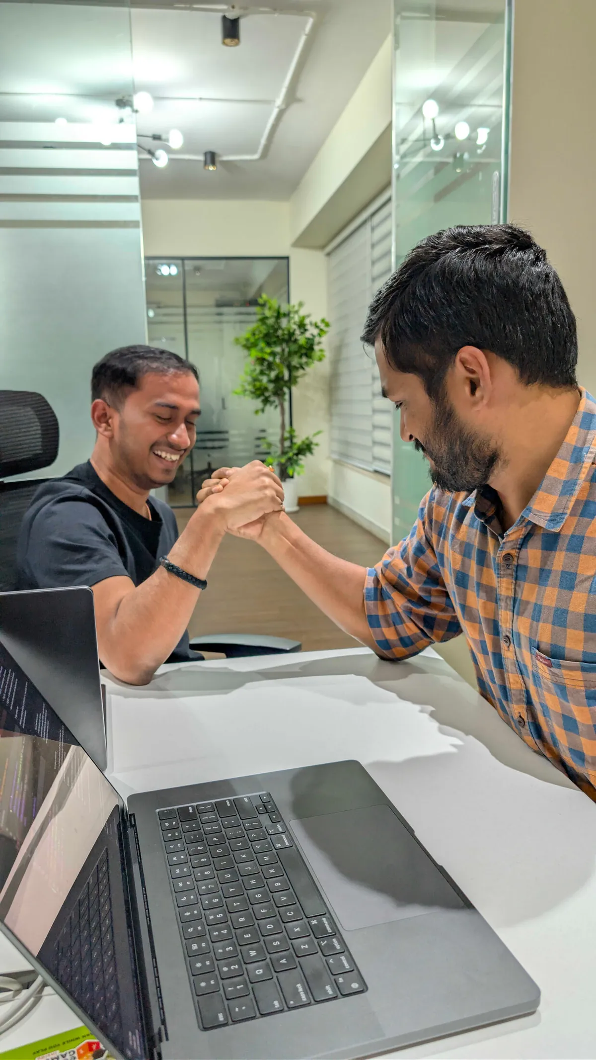 A friendly arm-wrestling match at the office